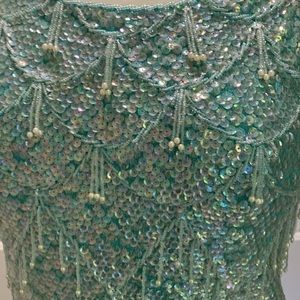 Brand new Size Small. Sleeveless  beaded top. Mint green. Elegant. Silk lined.